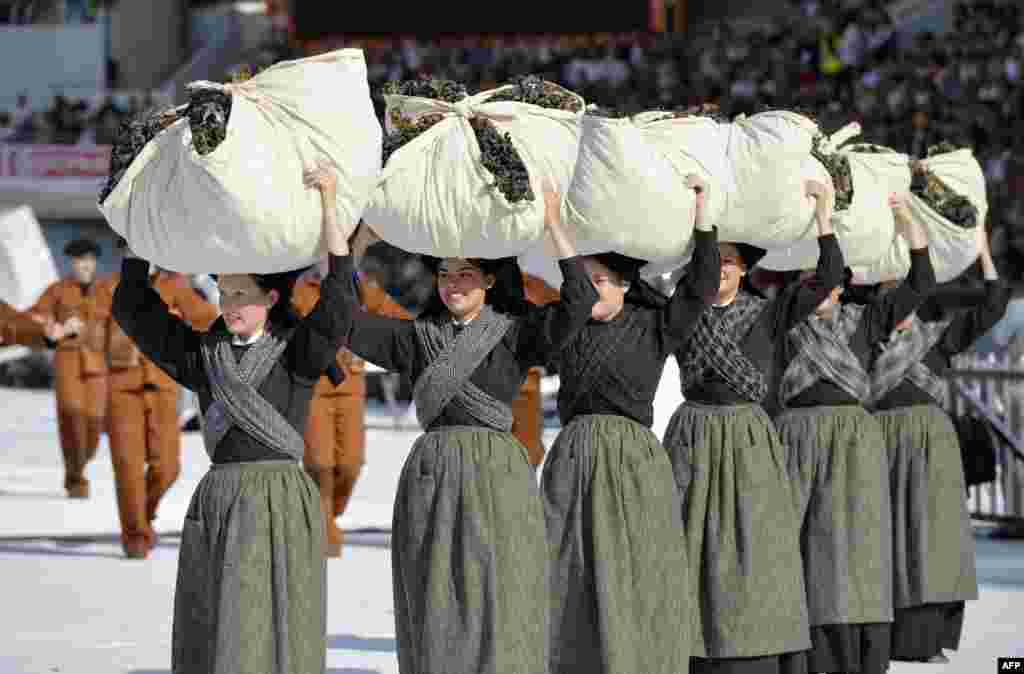 Women wearing traditional Breton costumes parade during the Lorient InterCeltic Festival in Lorient, Brittany, in France.