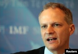 FILE- Alejandro Werner, Director of the Western Hemisphere Department of the International Monetary Fund, speaks during an IMF news conference in Montevideo, Uruguay, May 6, 2013.