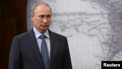 FILE - Russia's President Vladimir Putin is seen at an event in St. Petersburg, June 5, 2014.