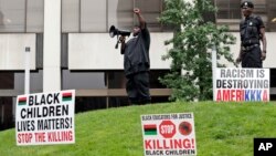 People participate in a rally against racism, injustice and white supremacy, in Perk Park, before the Republican National Convention in Cleveland, Ohio, July 16, 2016.