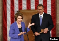Democratic leader Nancy Pelosi (L) introduces Speaker of the House John Boehner to speak after Boehner's re-election during the first day of the 113th US Congress in the Capitol in Washington, January 3, 2013.