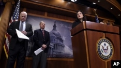 Sen. Kelly Ayotte (R), accompanied by Sen. John McCain (L), and Sen. Lindsey Graham, speaks during a news conference on Capitol Hill in Washington, Jan. 21, 2016, criticizing the Iran nuclear deal.