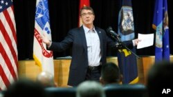 U.S. Defense Secretary Ashton Carter delivers a speech to U.S. troops at Camp Arifjan, Kuwait, Feb. 23, 2015. 