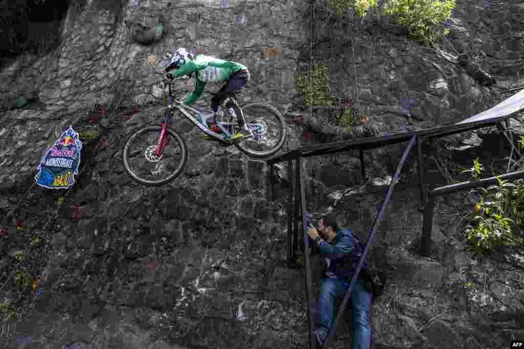 Colombian cyclist Camilo Sanchez is seen in action during the Red Bull Monserrate Cerro Abajo competition in Bogota, Feb. 6, 2021.