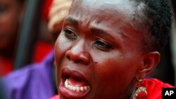 A woman attends a demonstration calling on the government to rescue the kidnapped Chibok school girls, outside the defense headquarters in Abuja, Nigeria, May 6, 2014. 