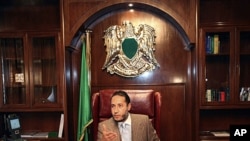 Saadi Gadhafi, a son of Libyan leader Moammar Gadhafi, speaks during a news conference at his office in Tripoli, January 31, 2010.