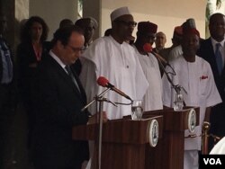 Nigerian President Muhammadu Buhari, shown delivering remarks at the outset of a security summit in Abuja with French President Francois Hollande, says the Lake Chad region must deal with rehabilitation of destroyed infrastructure and attend to displaced people, mo