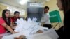 Officials begin the process of counting ballots after polls have closed in Cambodia's general election, at a polling station in Phnom Penh, July 29, 2018. 