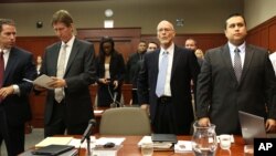 George Zimmerman, far right, stands for the judge arrival with, from left, assistant state attorney John Guy, defense attorney Mark O'Mara and co-defense counsel Don West in Seminole Circuit Court in Sanford, Florida, June 24, 2013.