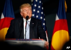 FILE - Republican presidential candidate Donald Trump speaks during a campaign rally in Denver, Colorado, July 29, 2016.