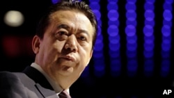 FILE - Then-Interpol President Meng Hongwei delivers his opening address at the Interpol world congress in Singapore, July 4, 2017.