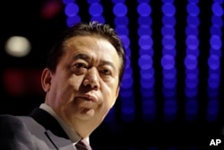 FILE - Then-Interpol President Meng Hongwei delivers his opening address at the Interpol world congress in Singapore, July 4, 2017.