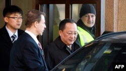 North Korean Foreign Minister Ri Yong Ho, center, leaves the Swedish government building Rosenbad in central Stockholm, March 16, 2018.