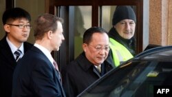 North Korean Foreign Minister Ri Yong Ho, center, leaves the Swedish government building Rosenbad in central Stockholm, March 16, 2018.