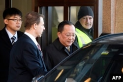 North Korean Foreign Minister Ri Yong Ho (C) leaves the Swedish goverment building Rosenbad in central Stockholm, March 16, 2018.
