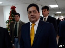 In this file photo taken on Jan. 7, 2013, opposition deputy Edgar Zambrano walks to a meeting of the country's clergy in Caracas.