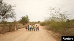 Students walk home from school in the outskirts of Badme, territorial dispute town between Eritrea and Ethiopia currently occupied by Ethiopia, June 8, 2018. 