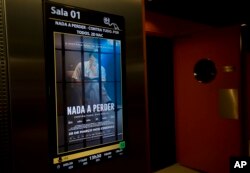 A poster promotes the film "Nada a Perder," or "Nothing to Lose," in a theater in Rio de Janeiro, May 11, 2018. The film, a biopic about the man who founded one of Brazil's largest evangelical churches, has sold more tickets than any other film in recent memory.
