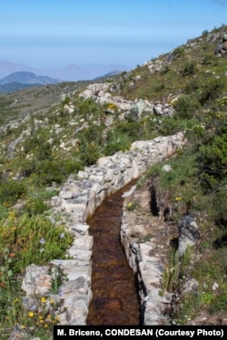 A stone water diversion canal system. The system increases the water's travel time from days to months to provide water throughout the dry season.