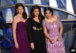 Ashley Judd, from left, Annabella Sciorra and Salma Hayek speak at the Oscars on Sunday, March 4, 2018, at the Dolby Theatre in Los Angeles. (Photo by Chris Pizzello/Invision/AP)
