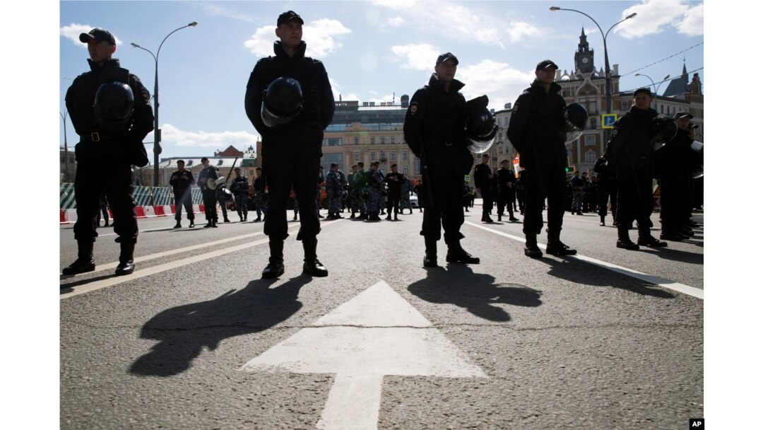 Police officers stay guard during an opposition rally in Moscow downtown, Russia, May 6, 2017. People gather for the rally against the Kremlin and demanding the release of political prisoners, five years since the opposition protest at May 6, 2012, that e
