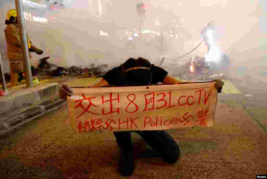 A protester holds a banner during a demonstration in Mong Kok district in Hong Kong, China.