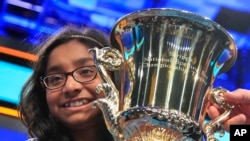Ananya Vinay, 12, from Fresno, Calif., holds the trophy after winning the 90th Scripps National Spelling Bee, in Oxon Hill, Md., June 1, 2017.
