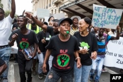 Supporters of the Black First Land First (BLF) movement march to Luthuli House, the South African ruling Party African National Congress (ANC) headquarters, to show their support for the South African president in Johannesburg, Feb. 5, 2018.