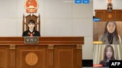 A virtual judge hears litigants in a case before a Chinese "internet court" in Hangzhou, China. (Courtesy: AFP/YouTube video) 