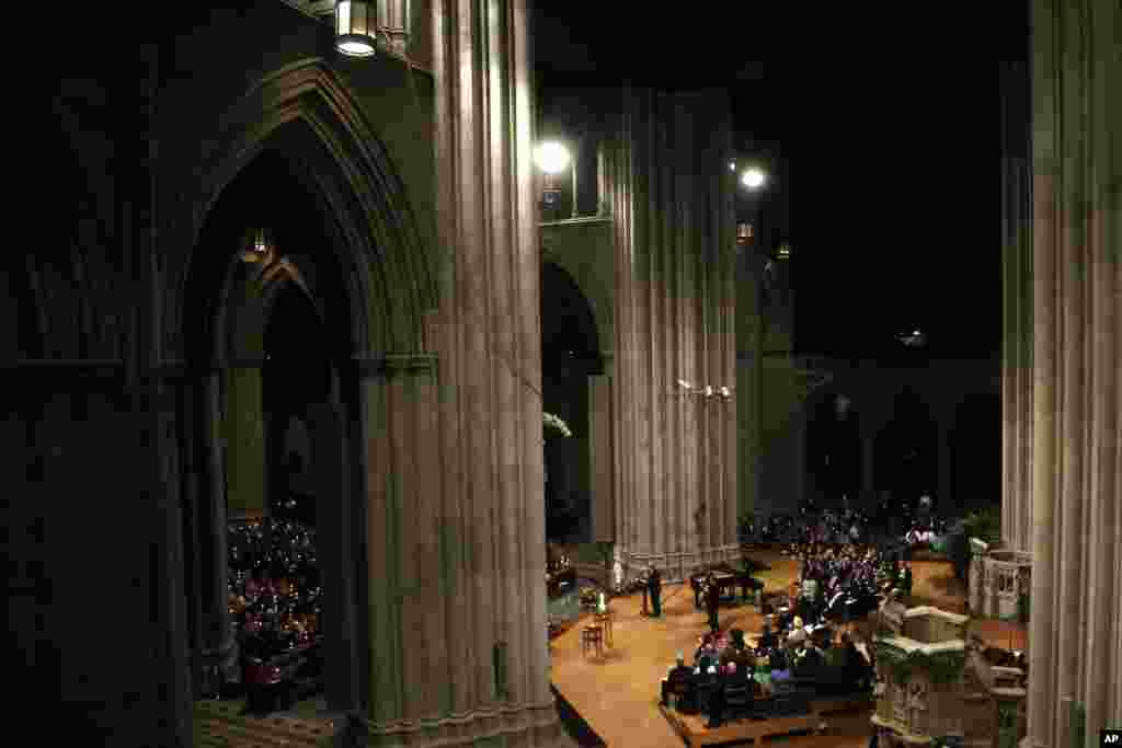 Candles are lit during a vigil for the victims of the shooting at Sandy Hook Elementary School in Newtown, Conn. and other victims of gun violence, National Cathedral, Washington, DC, Dec. 12, 2013.