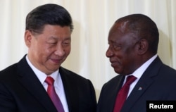 China's President Xi Jinping talks with South African President Cyril Ramaphosa after their media conference in Pretoria, South Africa, July 24, 2018.