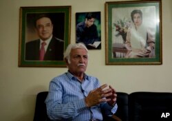 FILE - Pakistani Senator Farhatullah Babar talks to the Associated Press in Islamabad, Pakistan, Oct. 27, 2016.