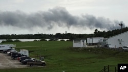 Smoke rises from a SpaceX launch site Thursday, Sept. 1, 2016, at Cape Canaveral, Fla. NASA said SpaceX was conducting a test firing of its unmanned rocket when a blast occurred. 