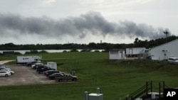 FILE - Smoke rises from a SpaceX launch site at Cape Canaveral, Fla, Sept. 1, 2016. SpaceX was conducting a test firing of its unmanned rocket when a blast and fire occurred. 
