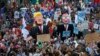 Protesters carry effigies of US President Donald Trump and Belgian PM Charles Michel during a demonstration in the center of Brussels, May 24, 2017. Demonstrators marched in Brussels ahead of a visit of US President Donald Trump and a NATO heads of state summit that will take place Thursday. 