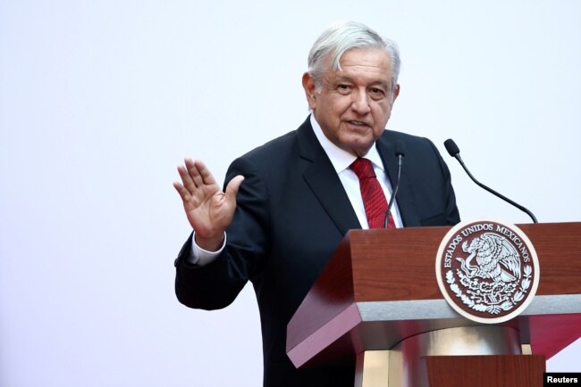 FILE - Mexico's President Andres Manuel Lopez Obrador gives a speech marking the first 100 days of his presidency at the National Palace in Mexico City, Mexico, March 11, 2019.