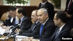 Israel's Prime Minister Benjamin Netanyahu (2nd R) attends the weekly cabinet meeting in Jerusalem, January 13, 2013.