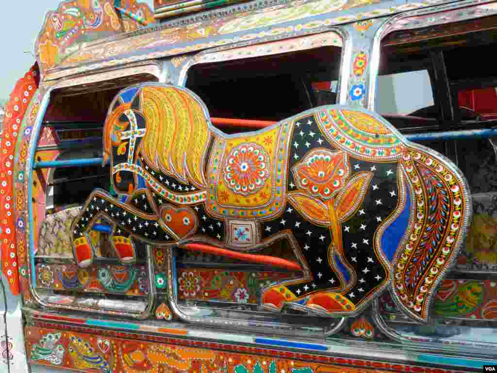 A close-up showing the detail of a heavily-decorated bus in Islamabad, Pakistan, July 10, 2012. (S. Gul/VOA)