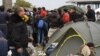 Many of the masses of refugees and other migrants from the Middle East and Africa, like these in Opatovac, Croatia, escaped extremist groups and are traveling in search of what they call "normal lives." (Heather Murdock/VOA)