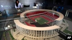 Miniature model of the National Stadium on display during preparations to host 2014 soccer World Cup, Brasilia, Brazil, April 1, 2013.