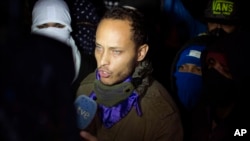 FILE - Oscar Perez speaks to the press in Caracas, Venezuela, July 13, 2017.