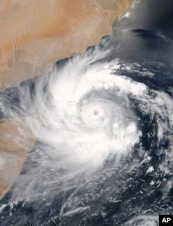 This satellite image provided by NASA shows Cyclone Mekunu over the Yemeni island of Socotra in the Arabian Sea as it heads for the coast of Oman, May 23, 2018.