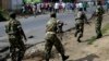 Soldiers from a special unit disperse a group of protesters by firing in the air in the Musage neighborhood of Bujumbura, Burundi, May 18, 2015.