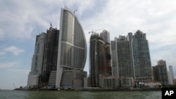FILE - Тhe Trump Ocean Club International Hotel and Tower, third building from left, are seen in Panama City, Panama, July 4, 2011. An attempt to oust President Donald Trump’s hotel business from managing a Panama luxury hotel has turned bitter, with accusations of financial misconduct.