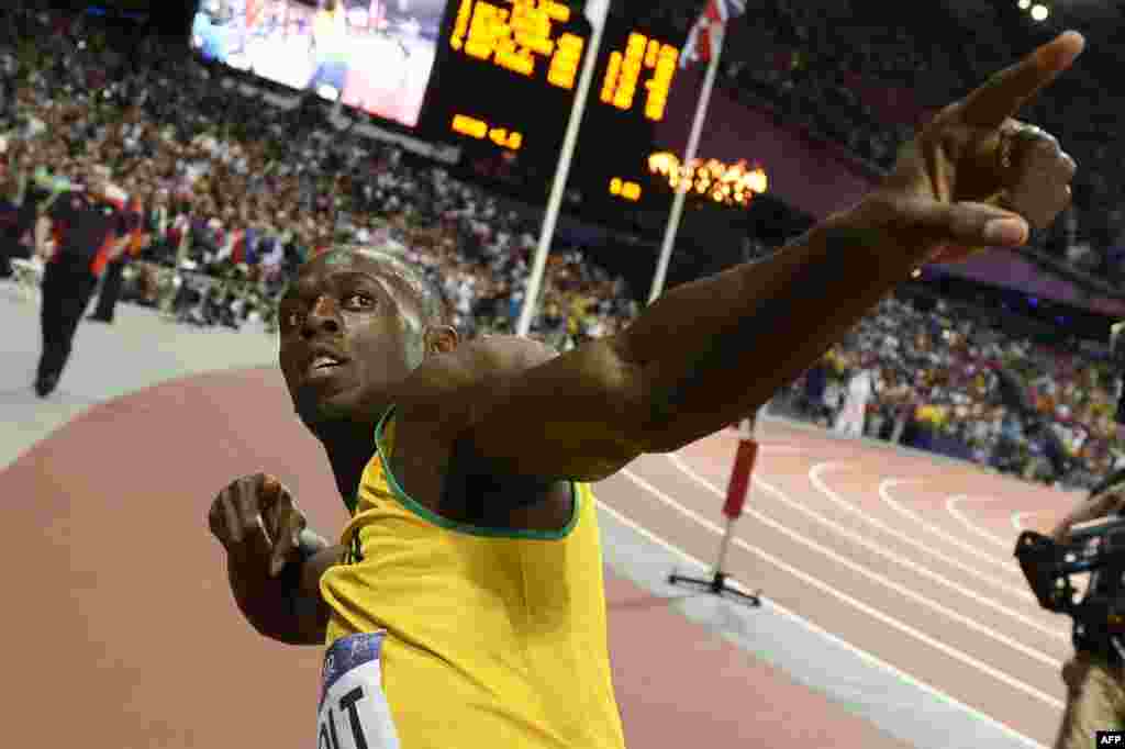 Jamaica's Usain Bolt reacts after winning the men's 100 meters race, August 5, 2012.