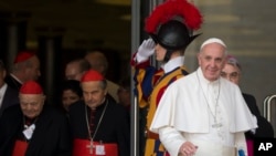 Pope Francis leaves a morning session of the Synod of bishops, at the Vatican, Oct. 5, 2015. He urged the contentious gathering of the world's bishops on family issues to put aside personal prejudices and have the courage and humility to be guided by God.