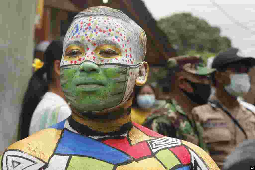 A man participates in the Hindu ritual of &quot;Grebeg&quot; at the Tegalalang village in Bali, Indonesia.