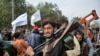 Des combattants talibans se rassemblent lors d'un rassemblement à Kaboul le 31 août 2021 alors qu'ils célèbrent le départ des troupes américaines.