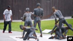 The National Memorial for Peace and Justice is seen, it's a new memorial that is opening to honor thousands of people killed in racist lynchings on Monday, April 23, 2018, in Montgomery, Ala. The Memorial and Justice and the Legacy Museum opens on April 26. (AP Photo/Brynn Anderson)