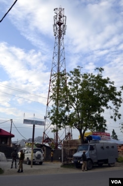 After unidentified militants threatened to attack mobile phone towers and kill the people who are involved in mobile service-related businesses in Kashmir, police have provided security to the towers in Baramulla district, June 3, 2015. (Tajamul Lone for